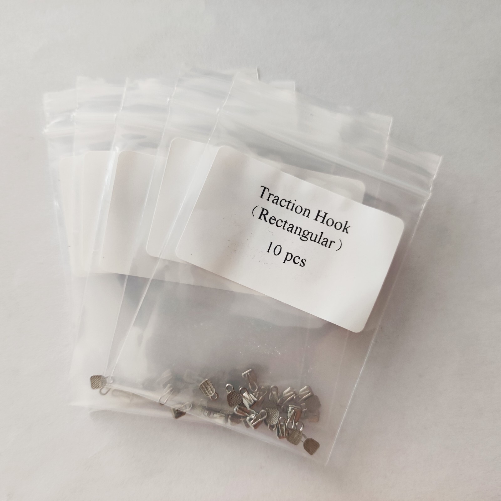 10 Packs 100pcs Dental Lingual Buttons With Traction Hook Rectangular Base